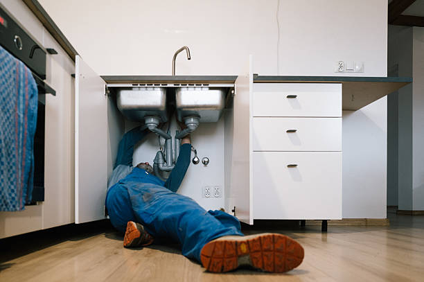 Professional Drain Cleaning technician working in Brooker, FL